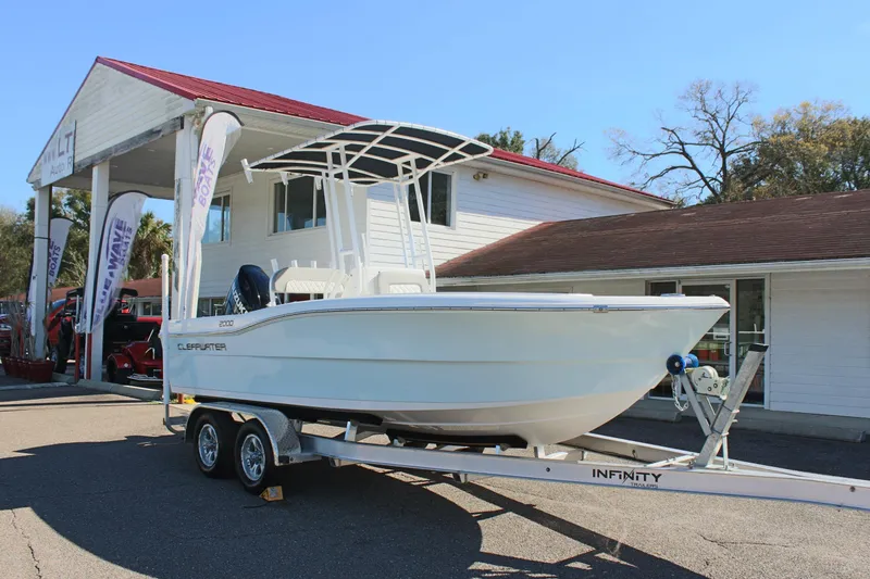 Slide: The Image of 2024 Clearwater 2000 CC boat on trailer outside dealership. - 4