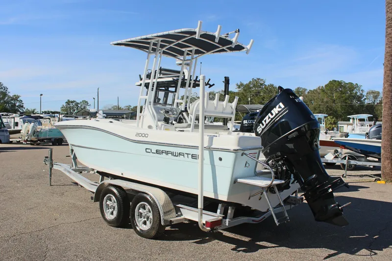Slide: The Image of 2024 Clearwater 2000 CC boat with Suzuki outboard motor on trailer. - 8