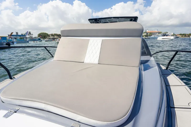 Slide: The Image of Luxurious 2026 Hanover 305 yacht with spacious sunbathing deck on a sunny day. - 21