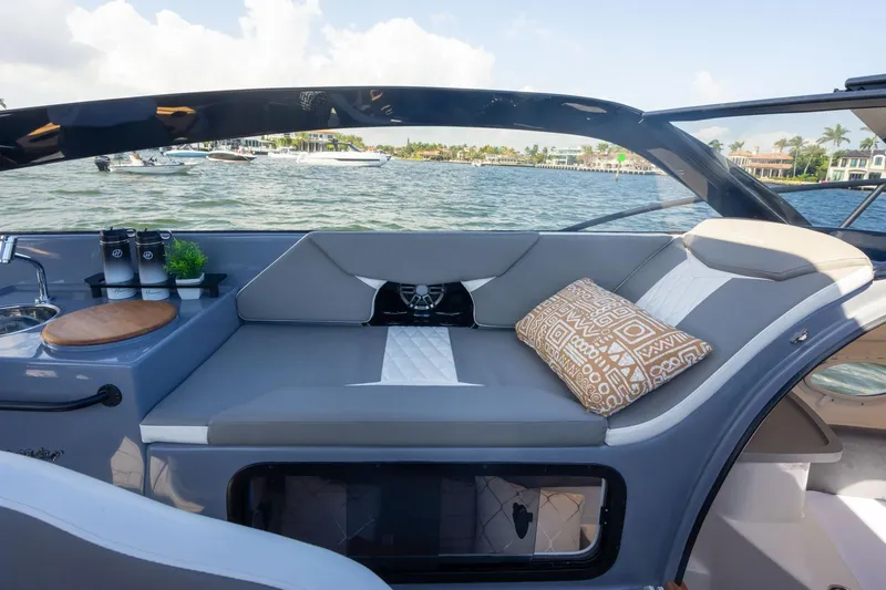Slide: The Image of Luxurious seating area on 2026 Hanover 305 boat with scenic waterfront view. - 23