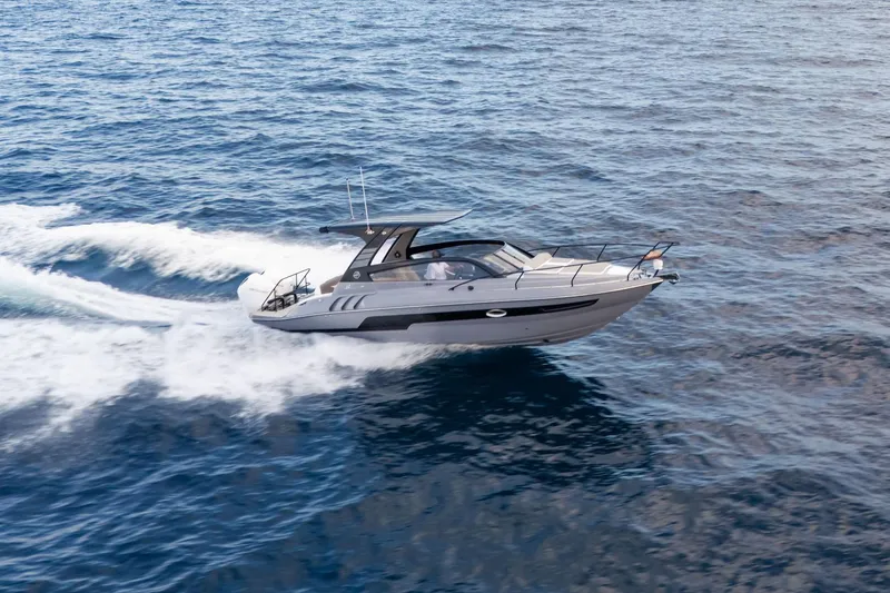 Slide: The Image of 2026 Hanover 305 yacht cruising on open sea, creating white water trails. - 7