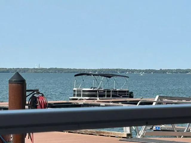 Slide: The Image of 2016 Sylvan Mirage 8520 LZ pontoon boat at lakeside dock. - 1