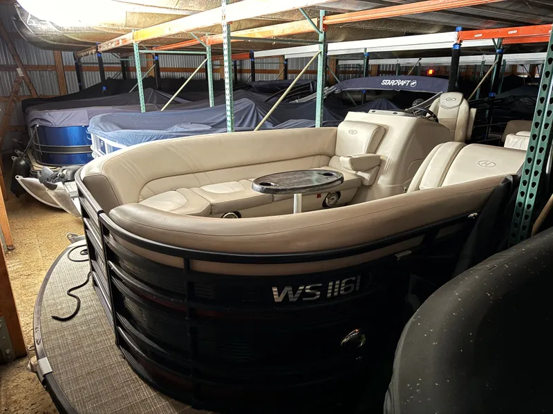 The Image of 2018 Harris 240 Solstice pontoon boat in storage facility. - 0
