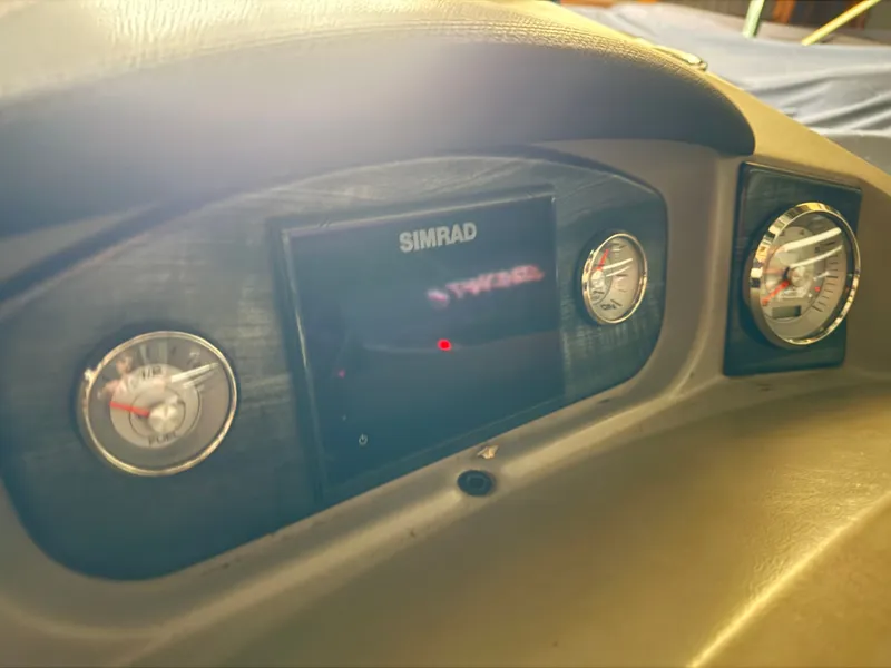 Slide: The Image of Dashboard of a 2018 Harris 240 Solstice with Simrad display. - 11