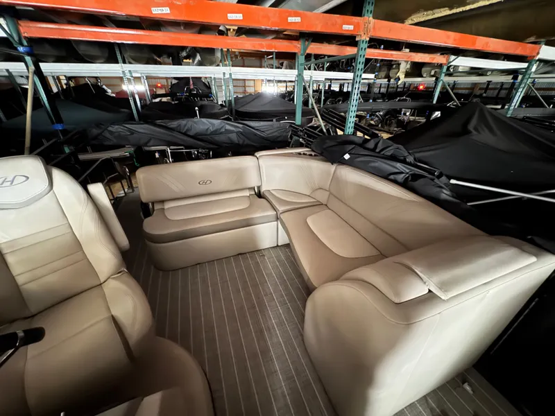 Slide: The Image of Interior of a 2018 Harris 240 Solstice pontoon boat in storage facility. - 18
