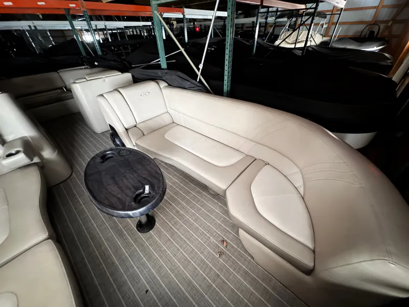 Slide: The Image of Interior of a 2018 Harris 240 Solstice pontoon boat with beige seating. - 2