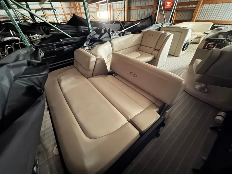 Slide: The Image of Interior of a 2018 Harris 240 Solstice pontoon boat with beige leather seating. - 20