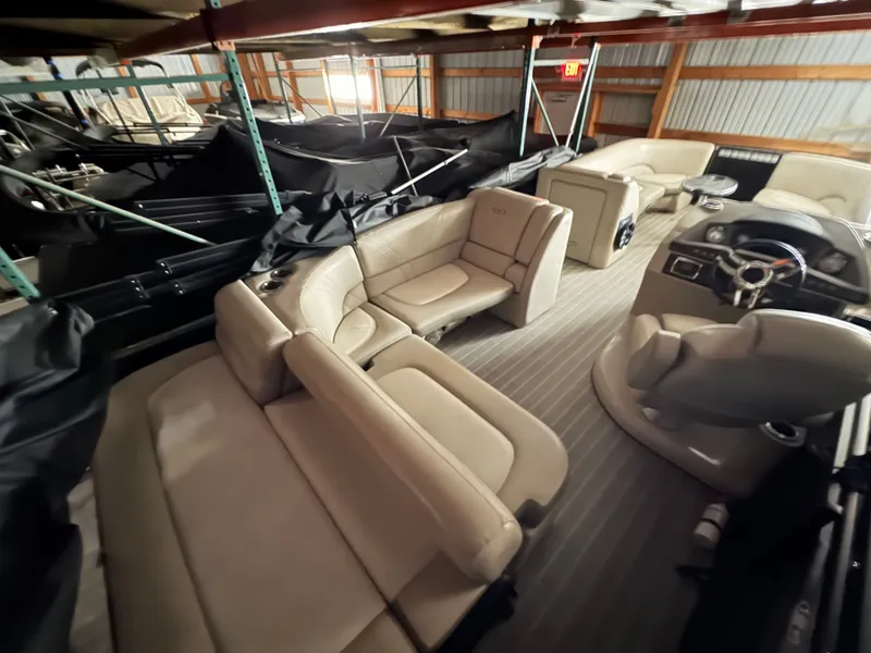 Slide: The Image of Interior of a 2018 Harris 240 Solstice pontoon boat in storage facility. - 23