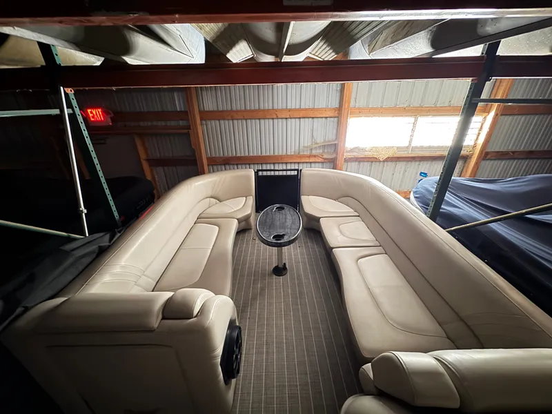 Slide: The Image of Interior of a 2018 Harris 240 Solstice boat with beige seating. - 24