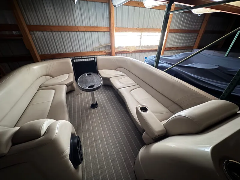 Slide: The Image of Interior of a 2018 Harris 240 Solstice pontoon boat with beige leather seating. - 3