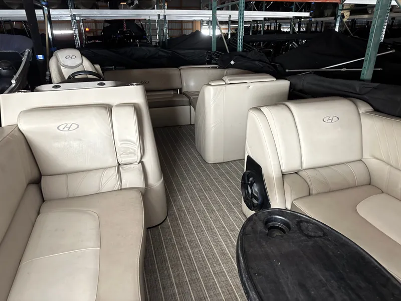 Slide: The Image of Interior of a 2018 Harris 240 Solstice pontoon boat with beige seating. - 6