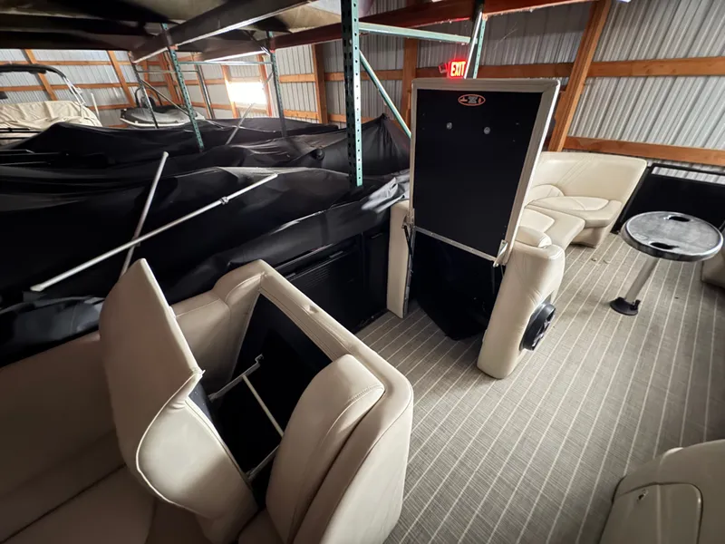 Slide: The Image of Interior of a 2018 Harris 240 Solstice pontoon boat in storage facility. - 7