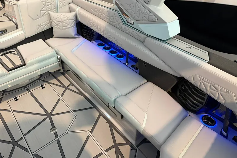 Slide: The Image of Luxurious interior of 2026 Nautique Super Air Nautique G25 Paragon with ambient lighting. - 22