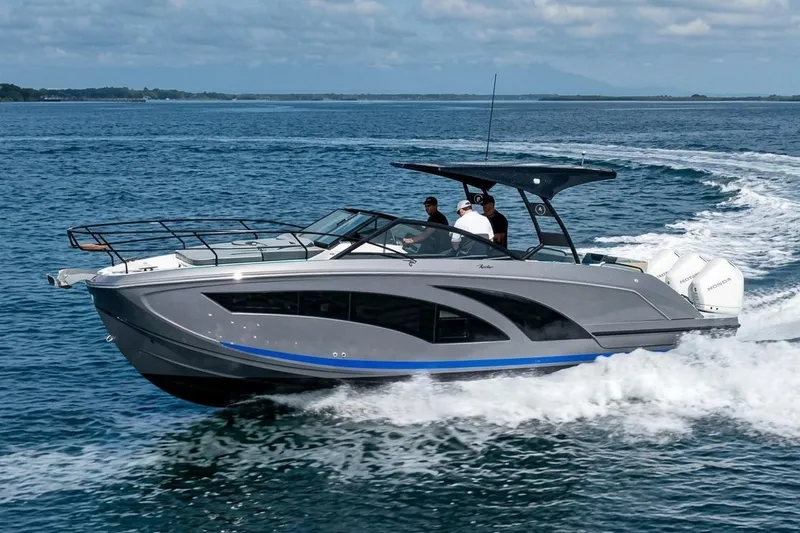 The Image of 2026 Hanover 327 boat cruising on open water, showcasing sleek design and powerful engines. - 0