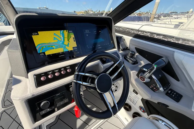 Slide: The Image of 2024 Cobalt R8 Outboard helm with advanced navigation and control systems. - 11
