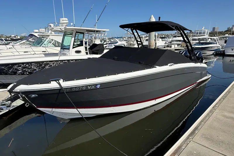 Slide: The Image of 2024 Cobalt R8 Outboard boat docked at marina, covered and ready for adventure. - 23