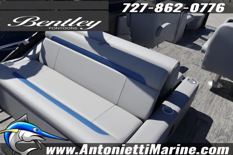 Slide: The Image of 2026 Bentley Pontoons Legacy 243 Swingback EXT interior with gray and blue seating. - 12