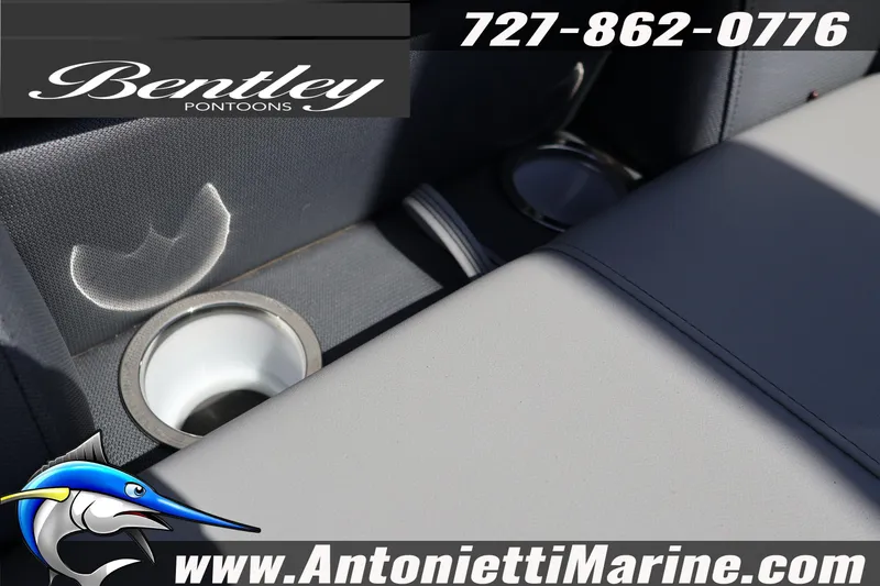 Slide: The Image of 2026 Bentley Pontoons Legacy 243 Swingback EXT interior with cup holders, showcased by Antonietti Marine. - 16