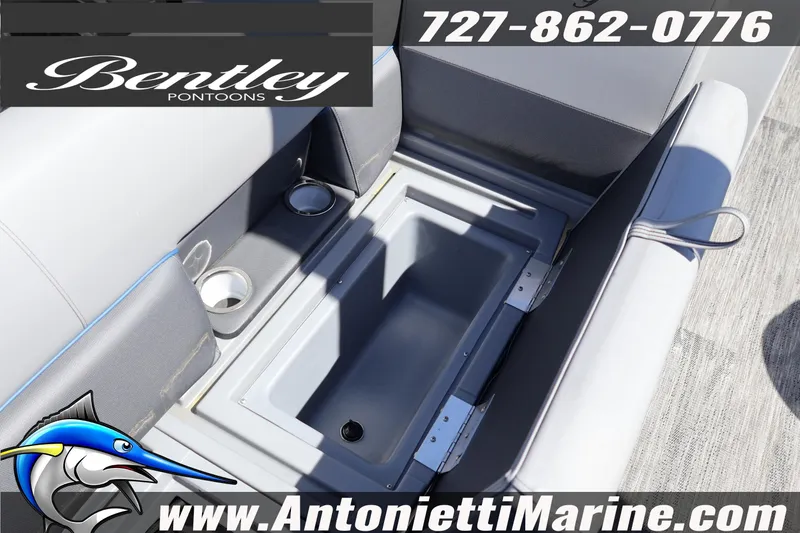 Slide: The Image of Bentley Pontoons Legacy 243 Swingback EXT 2026 interior with storage compartment and cup holders. - 17