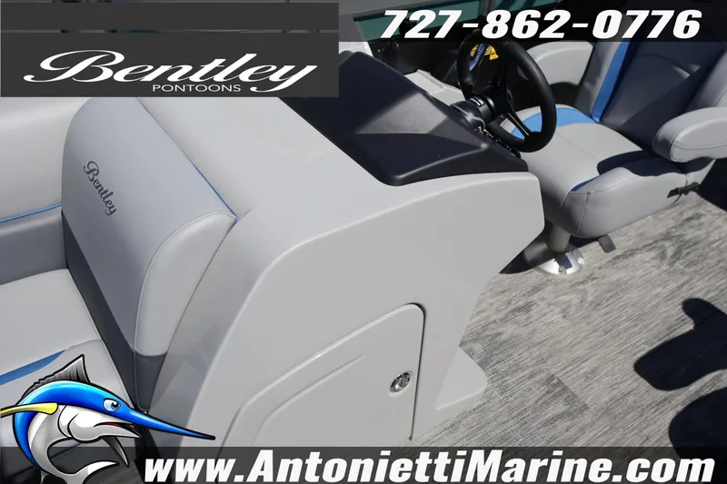Slide: The Image of 2026 Bentley Pontoons Legacy 243 Swingback EXT interior with steering wheel and seating. - 19