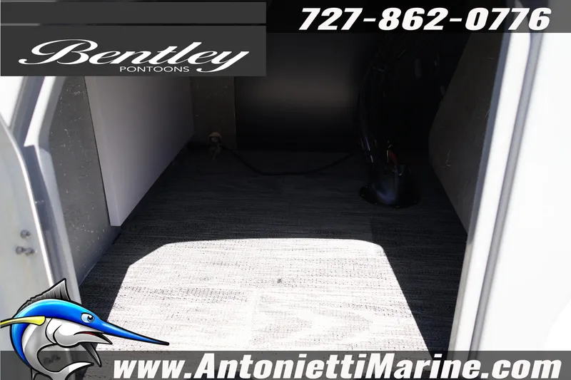 Slide: The Image of Interior view of 2026 Bentley Pontoons Legacy 243 Swingback EXT, featuring carpeted flooring. - 20