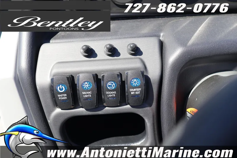 Slide: The Image of Control panel of 2026 Bentley Pontoons Legacy 243 Swingback EXT with various switches. - 23