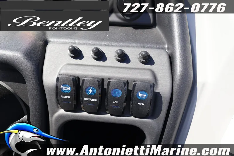Slide: The Image of Control panel of 2026 Bentley Pontoons Legacy 243 Swingback EXT with stereo and electronics switches. - 24