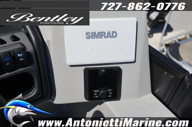 Slide: The Image of 2026 Bentley Pontoons Legacy 243 Swingback EXT dashboard with Simrad and JBL controls. - 25