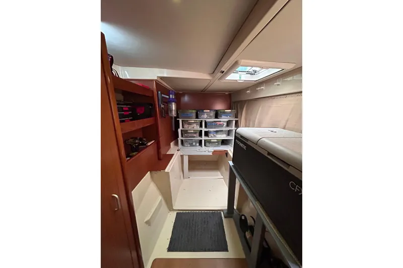 Slide: The Image of Interior of a 2013 Leopard 48 yacht with organized storage and modern amenities. - 25