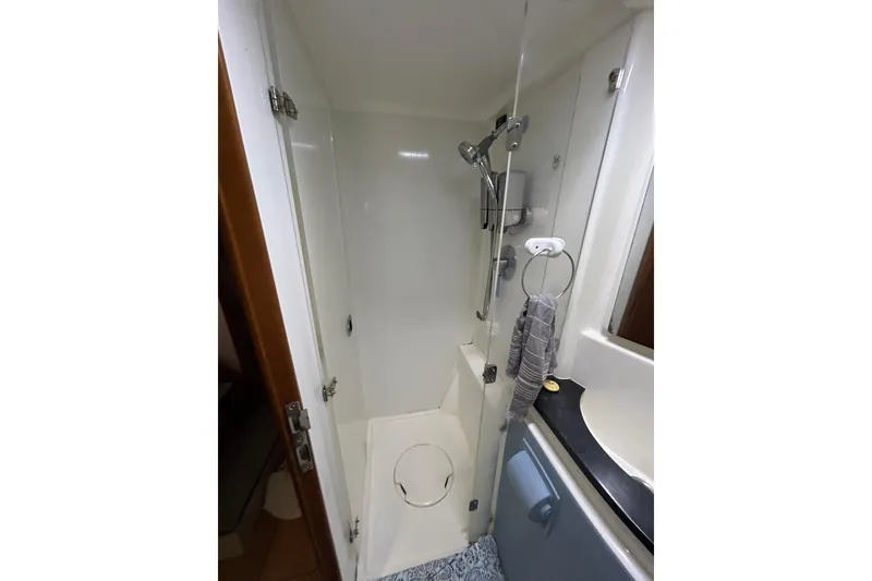 Slide: The Image of Compact shower area in a 2013 Leopard 48 yacht bathroom. - 30