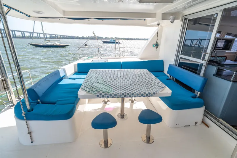 Slide: The Image of Luxurious 2013 Leopard 48 yacht with spacious outdoor seating and scenic water view. - 32