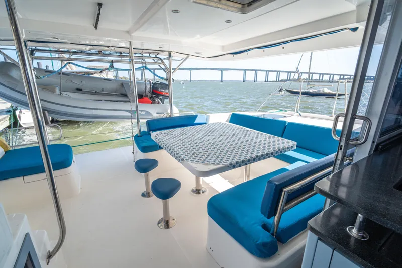 Slide: The Image of Spacious deck of 2013 Leopard 48 yacht with blue seating and ocean view. - 35