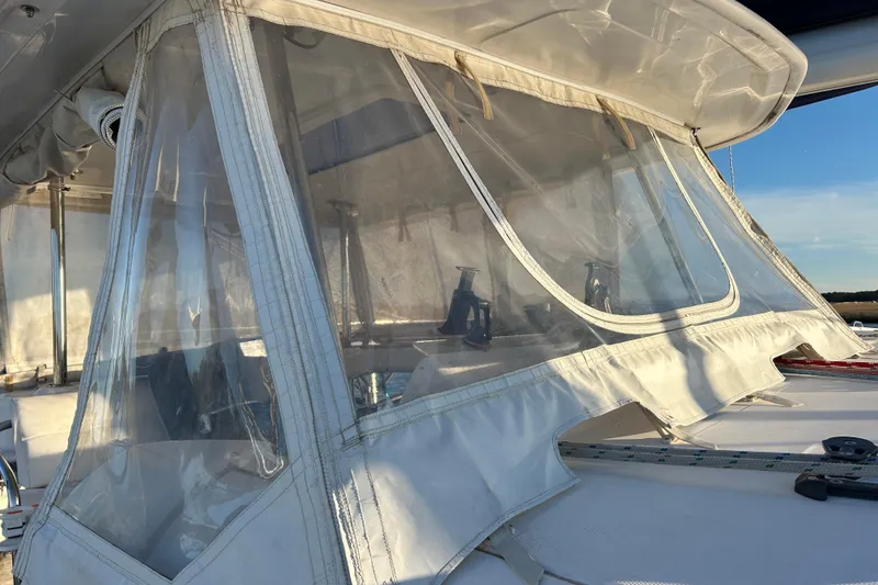 Slide: The Image of Leopard 48 sailboat with clear protective canopy, 2013 model, sunlit exterior view. - 39