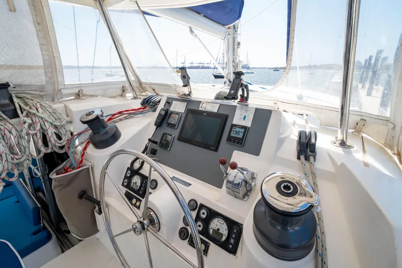 Slide: The Image of Helm of 2013 Leopard 48 yacht with navigation instruments and steering wheel. - 43