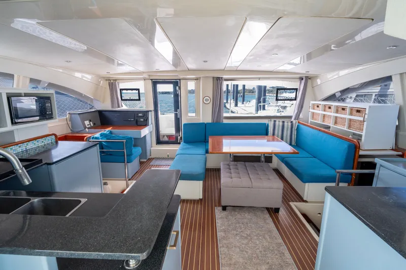 Slide: The Image of Luxurious interior of a 2013 Leopard 48 yacht with modern kitchen and seating area. - 45