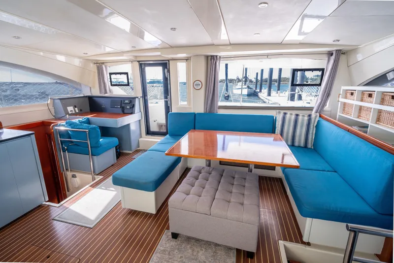 Slide: The Image of Luxurious interior of 2013 Leopard 48 yacht with blue seating and wooden accents. - 46