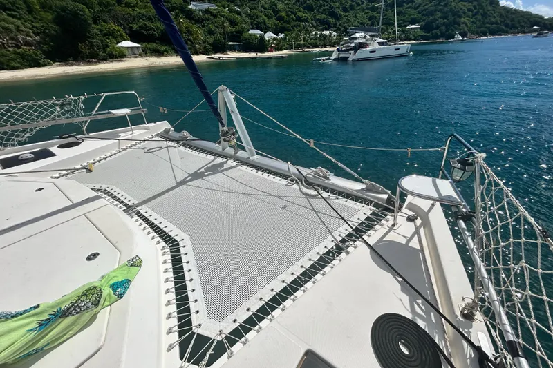 Slide: The Image of Leopard 48 catamaran anchored near a tropical beach, 2013 model. - 5
