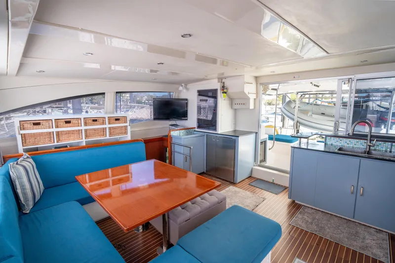 Slide: The Image of Luxurious interior of a 2013 Leopard 48 yacht with modern kitchen and seating area. - 53