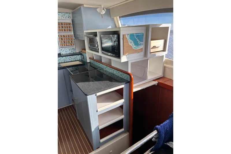 Slide: The Image of Modern kitchen interior of 2013 Leopard 48 yacht with sleek countertops and appliances. - 57