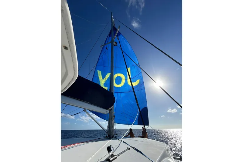 Slide: The Image of Sailing on a 2013 Leopard 48 yacht with blue sail in sunny ocean. - 6