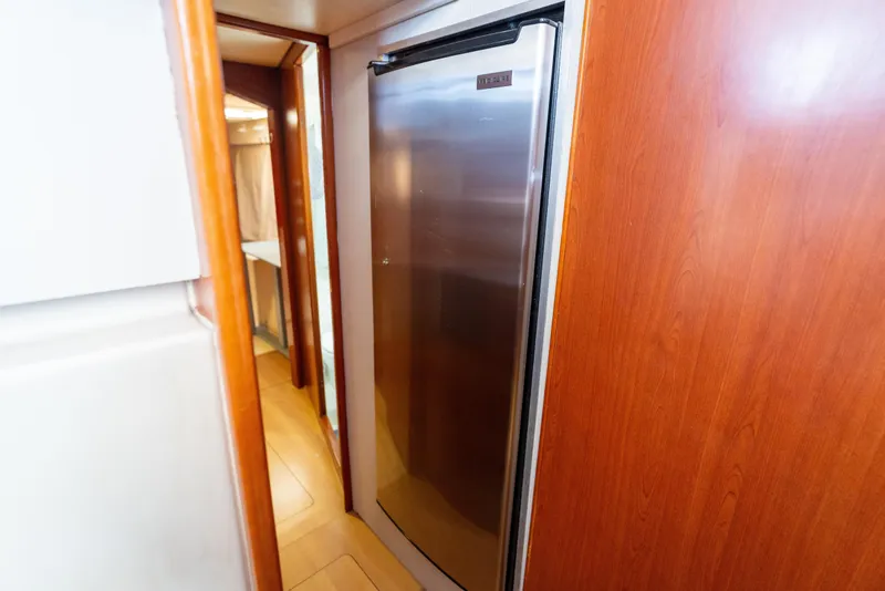 Slide: The Image of Stainless steel refrigerator in 2013 Leopard 48 yacht interior hallway. - 71