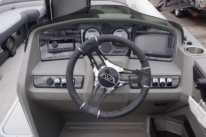 Slide: The Image of Steering console of 2026 Avalon Catalina Versatile Rear Bench boat, featuring modern controls and navigation. - 12