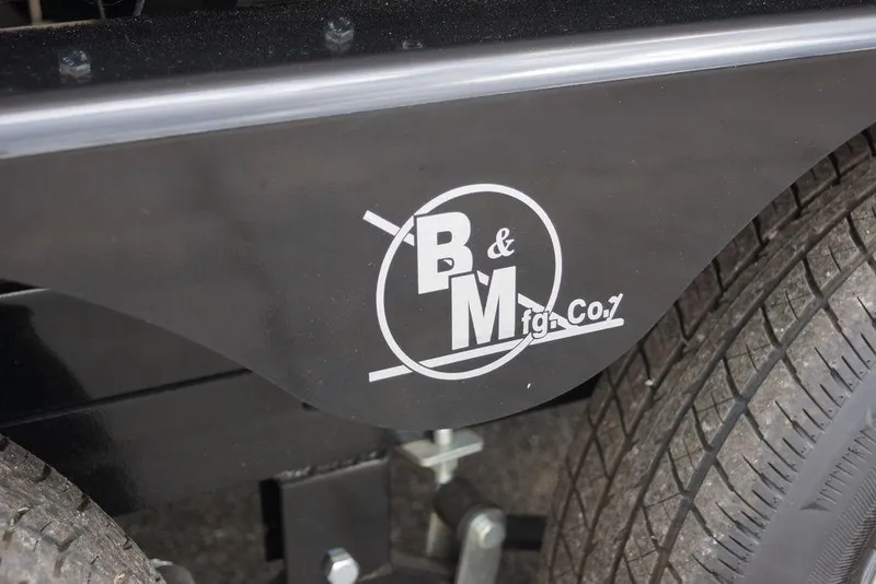Slide: The Image of Close-up of B&M Mfg. Co. logo on Avalon Catalina Versatile Rear Bench, 2026 model. - 5
