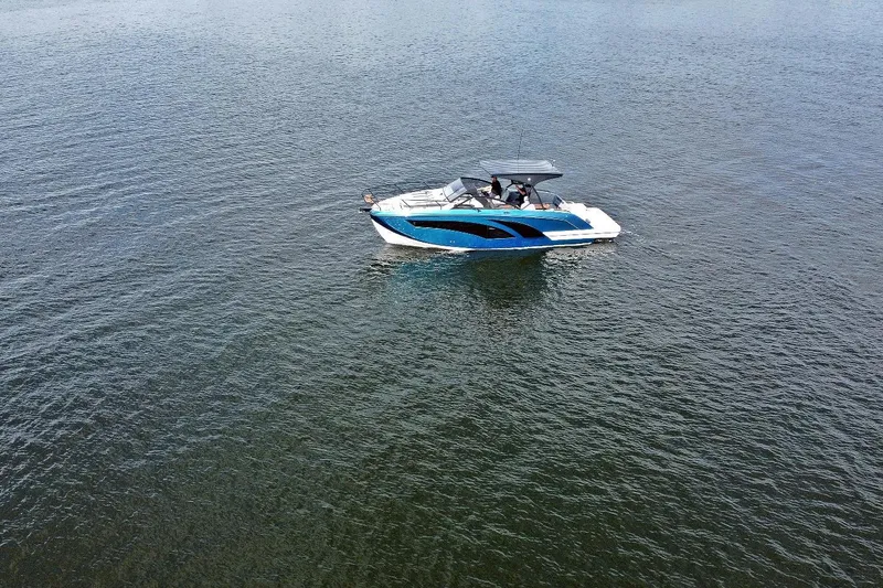 Slide: The Image of 2026 Hanover 327 boat cruising on calm waters, showcasing sleek design and modern features. - 3