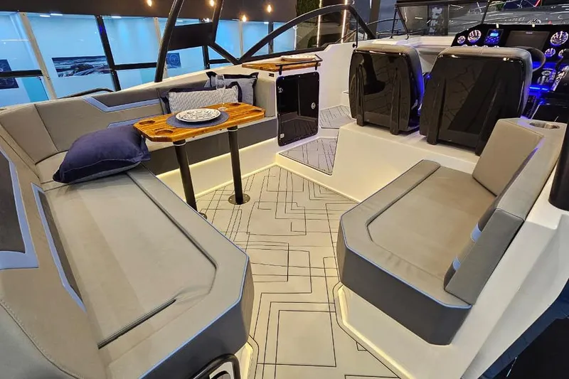 Slide: The Image of Luxurious interior of 2026 Hanover 327 boat with modern seating and elegant table setup. - 9