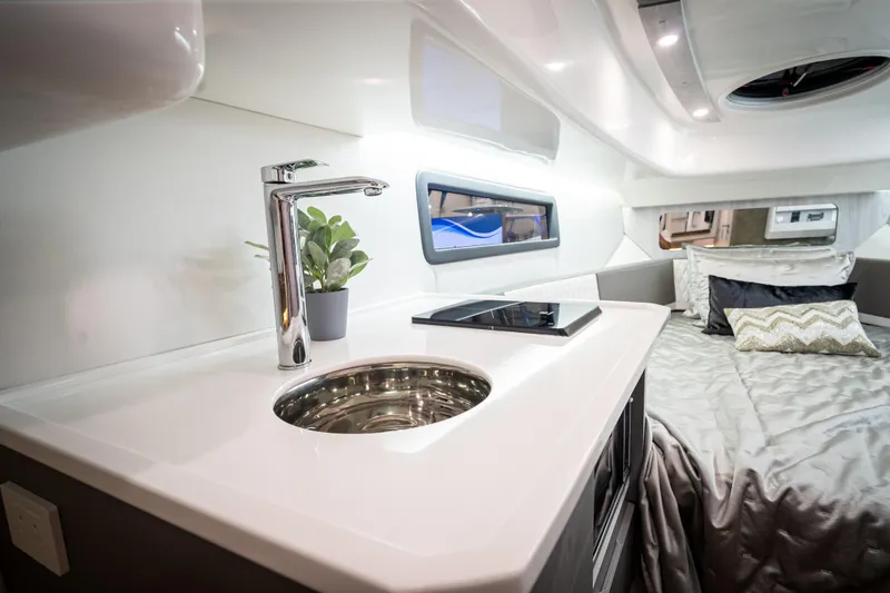 Slide: The Image of Luxurious interior of 2026 Hanover 347 with modern kitchenette and cozy sleeping area. - 14