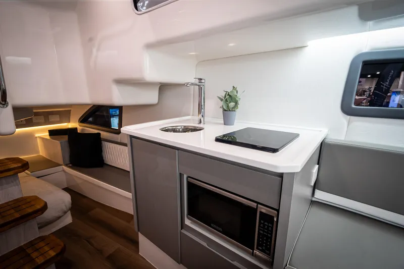 Slide: The Image of Modern kitchen interior of Hanover 347 yacht, featuring sleek design and compact appliances, 2026 model. - 16