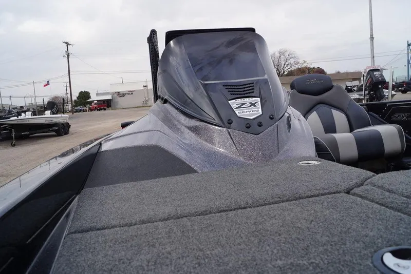 Slide: The Image of 2019 Skeeter ZX250 boat with sleek design and comfortable seating in outdoor setting. - 15