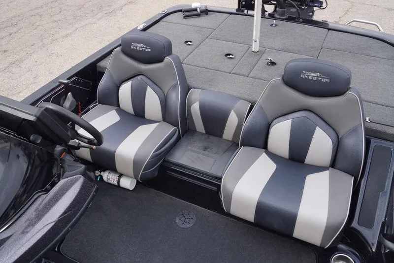 Slide: The Image of 2019 Skeeter ZX250 boat interior with dual gray and black seats. - 16