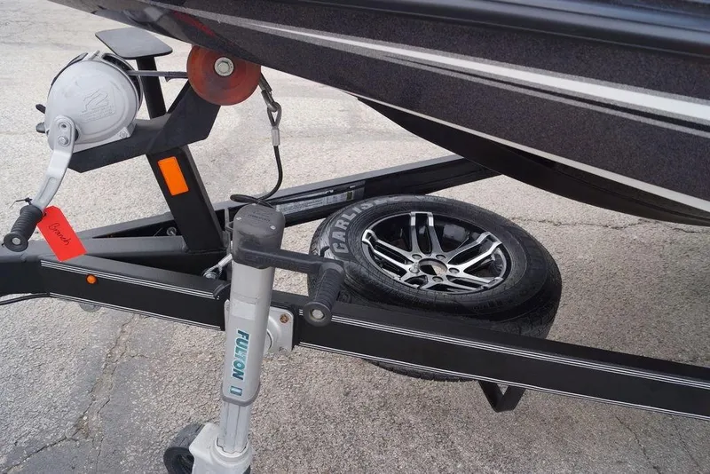 Slide: The Image of 2019 Skeeter ZX250 boat trailer with spare tire and winch system. - 17